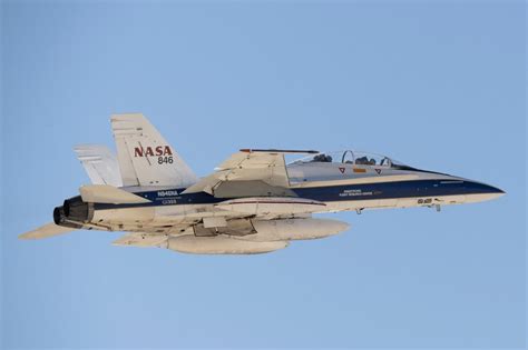 nasa f-15b with high-visibility blue-and-white scheme in flight