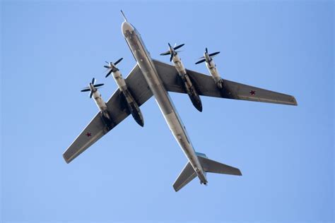 NATO fighter jet intercepting Russian Tu-95 bomber in European airspace
