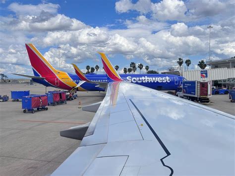 nfl fans boarding southwest airlines weekend game flights with team apparel