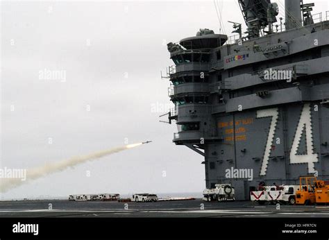 Nimitz class carrier deck operations with Sea Sparrow missile system visible