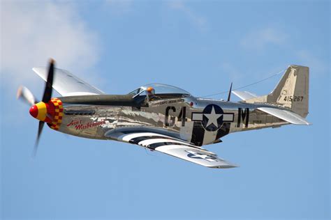 North American P-51 Mustang vintage World War II fighter aircraft flying airshow