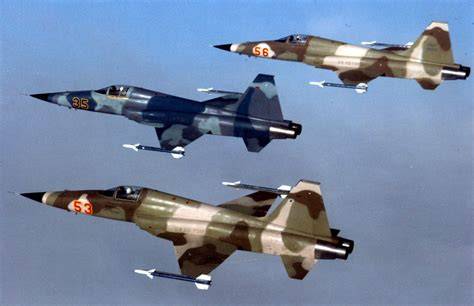 Northrop F-5 Tiger II aggressor jet flying in US military training colors