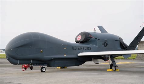 Northrop Grumman RQ-4 Global Hawk flying over Pacific fleet base