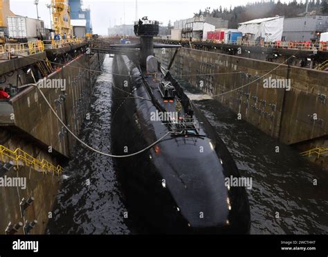 Ohio-class submarine surfacing with Trident missile tubes open