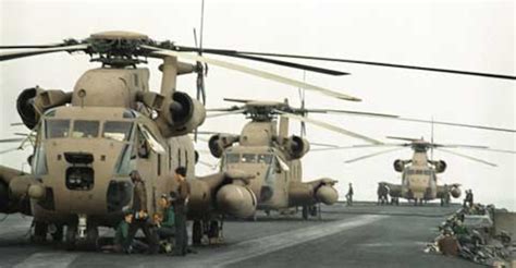 Operation Eagle Claw desert staging area with C-130 aircraft and RH-53 helicopters