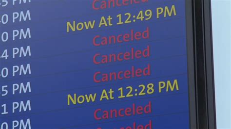 overwhelmed airline service desk with passengers rebooking during storm delays
