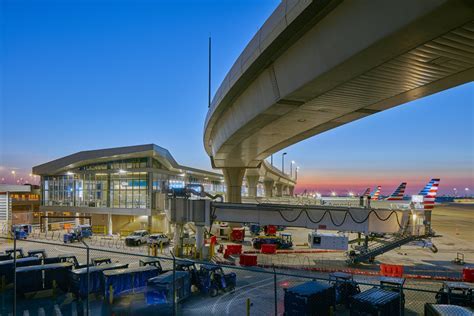packed departure gates at DFW with stranded summer travelers