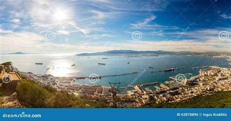 panoramic view of Gibraltar’s Rock with bustling harbor and cityscape