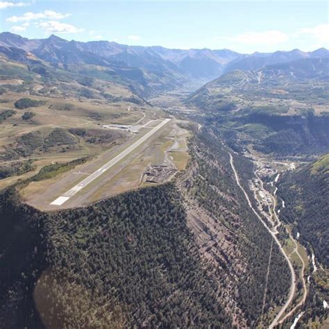 panoramic view of telluride colorado valley with airport plateau in foreground