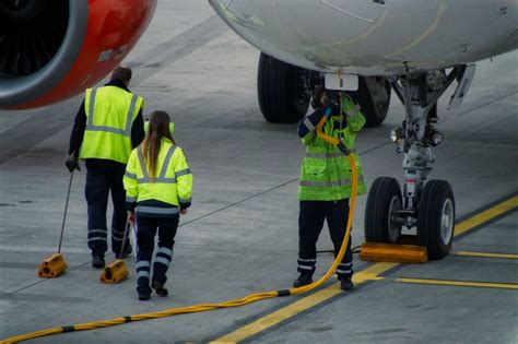 Paris CDG Airport ground crews working in thunderstorm conditions