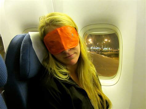passenger adjusting watch to new timezone after red eye flight arrival