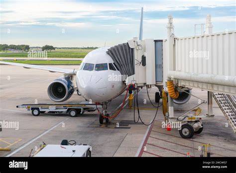 passenger aircraft being refueled at airport gate before short haul flight