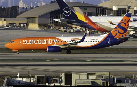 Passenger boarding Sun Country Airlines leisure flight