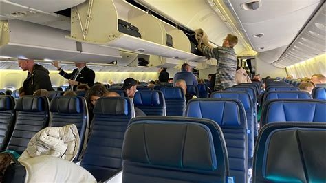 passenger enjoying reclined seat and meal in premium economy on long haul flight