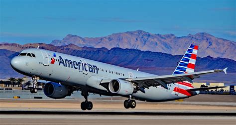 Passenger using high-speed inflight WiFi on American Airlines Airbus cabin