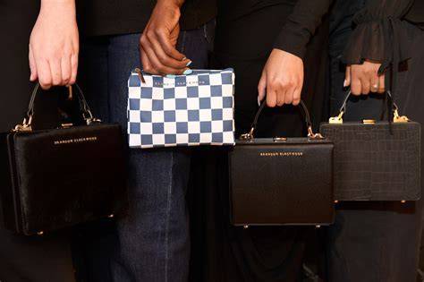passengers admiring Brandon Blackwood-designed airline kits during flight