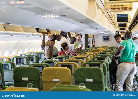 passengers boarding ethiopian airlines widebody for long haul flight at dawn