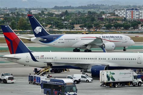 passengers boarding westjet and aeromexico codeshare flight at toronto airport