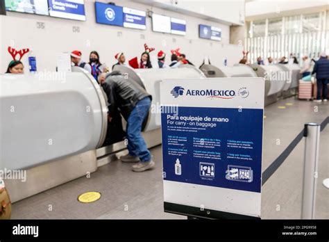 Passengers checking in at WestJet-Aeromexico codeshare counter in Mexico City