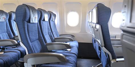 Passengers enjoying Air Canada’s Premium Economy cabin