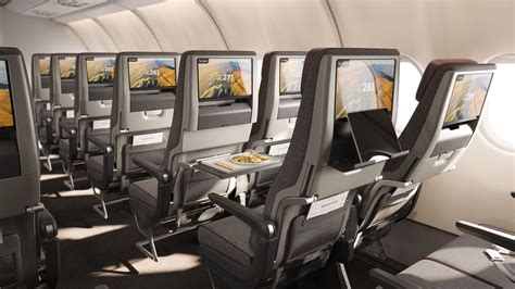 passengers enjoying comfort upgrades in economy on international flight