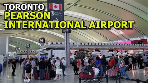Passengers queuing at Toronto Pearson International Airport during severe weather delays