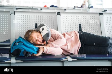 passengers sleeping in terminal chairs amid mass flight delays in Vancouver