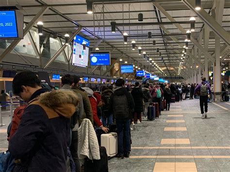Passengers stranded at Vancouver International Airport amid severe rain and flight disruptions