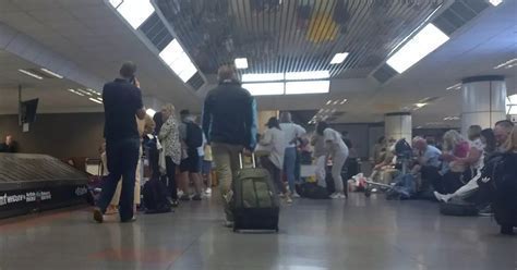 passengers stranded overnight at Denver airport after Frontier flight cancellation