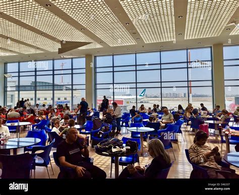 passengers waiting at Ben Gurion Airport amid flight cancellations