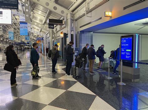 passengers waiting departure gate Chicago O’Hare improved schedule operations