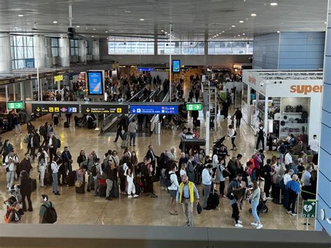 Passengers waiting during Italy airport strike at Rome Fiumicino terminal July 2025