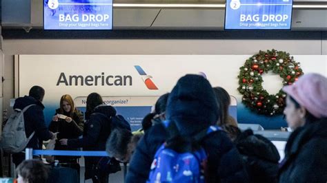 Passengers waiting inside Grand Cayman terminal during American Airlines delay