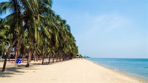 peaceful bang saen beach with morning light and fishing boats in chonburi thailand