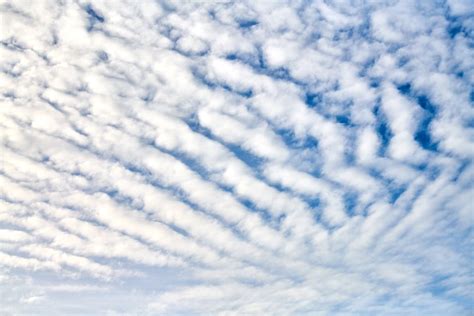 pearlescent colors in thin cirrocumulus clouds near the sun