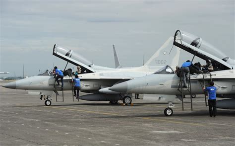 Philippine Air Force ground crew maintaining upgraded FA-50PH jets on tarmac