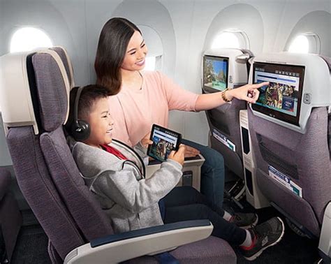 philippine airlines economy passengers relaxing on long-haul flight
