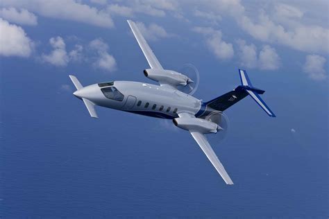 Piaggio P.180 Avanti in flight showcasing distinctive canard and pusher propeller design