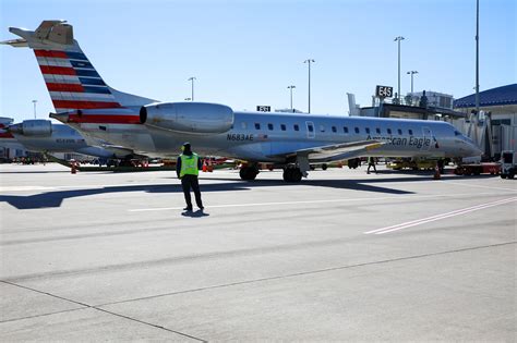 Piedmont Airlines crew team in front of ERJ 145 at Charlotte Douglas International Airport