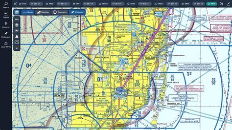 pilot holding sectional chart next to aircraft dashboard during flight planning