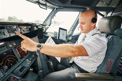 pilot performing final control check before takeoff at dusk