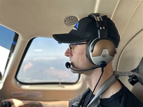 Pilot using Lightspeed Delta Zulu headset during cross-country flight