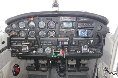 Piper Arrow cockpit panel with analog gauges mid-flight