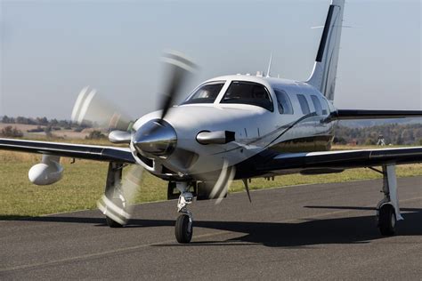 Piper M500 in mid-air against the backdrop of clear skies