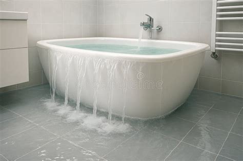 poorly enclosed hotel shower with water spilling onto bathroom floor