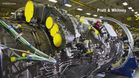 Pratt & Whitney F135 engine test facility with engineers inspecting machinery