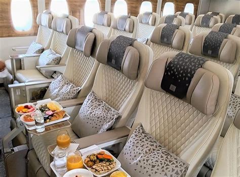 premium economy airline cabin with spacious seating and upgraded dining service