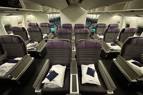 premium economy airplane cabin with spacious seats and extended legroom