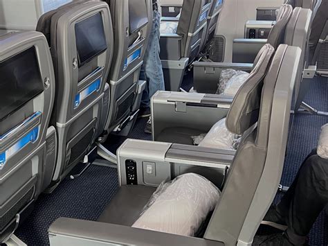 premium economy airplane seat wide legroom meal service