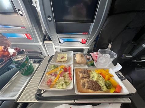 premium transatlantic business class dining experience narrowbody aircraft cabin